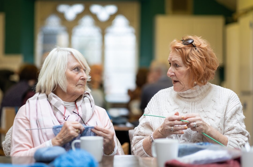 Seniors participating in a handicraft workshop at a table